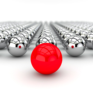 single red marble in front of many silver marbles